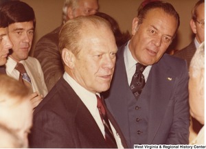 Gerald Ford (center) speaking to people during a campaign rally for Arch Moore.