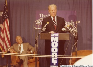 Gerald Ford speaking during Arch Moores campaign rally for governor. Arch is sitting to the left of Ford.