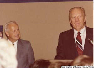 Gerald Ford speaking during Arch Moore's campaign rally for governor. Arch is standing to the left of Ford.
