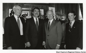 Governor Arch Moore (second from right) standing with three unidentified men.