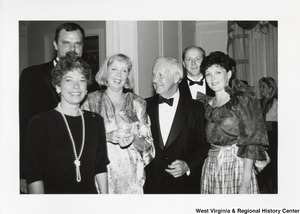 Governor Arch Moore (third from right) with three unidentified women and two men at a party.