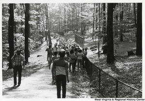 A large crowd of visitors on a path at the West Virginia Wildlife Center, formerly known as the French Creek Game Farm.