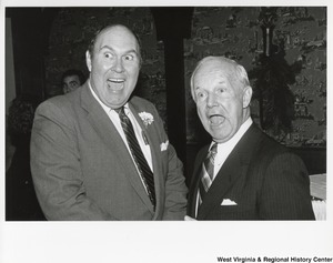 Governor Arch Moore and an unidentified man giving a surprised face to the camera.