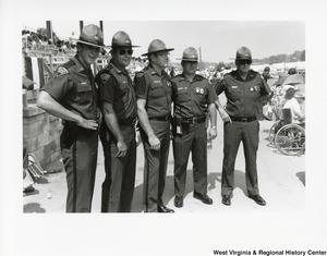 Five unidentified State Police Officers at an event outside.