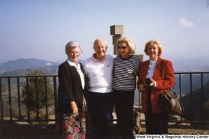Shelley and Arch Moore standing with two unidentified women. Behind them is a view of mountains.