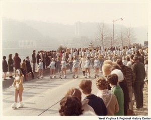 An unidentified high school marching band during Governor Arch Moores inaugural parade in Charleston. The band is wearing light blue and gold uniforms.