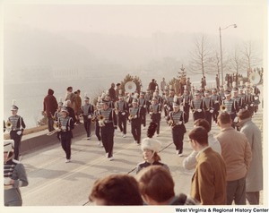 An unidentified high school during Governor Arch Moores inaugural parade in Charleston. The band is wearing black and grey uniforms.