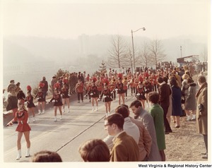An unidentified high school during Governor Arch Moores inaugural parade in Charleston. The band and majorettes are wearing red and black uniforms.