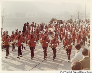 An unidentified high school during Governor Arch Moores inaugural parade in Charleston. The band is wearing red and black uniforms.
