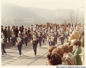 An unidentified high school during Governor Arch Moores inaugural parade in Charleston. The band is wearing blue and white uniforms with a grey LC on the chest.